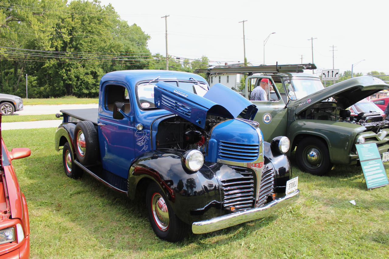 1940s Dodge pickup, blue and black, hood open front three-quarter view