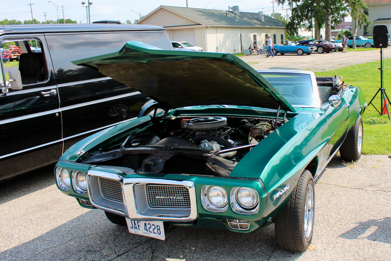 1960s Pontiac Firebird convertible, green, hood open front three-quarter view